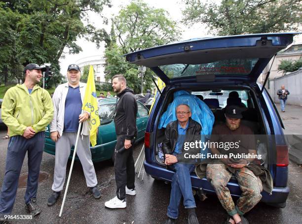 Demonstrators block Hrushevskoho Street running through government quarters during a rally for the adoption of a draft bill on customs clearance and...