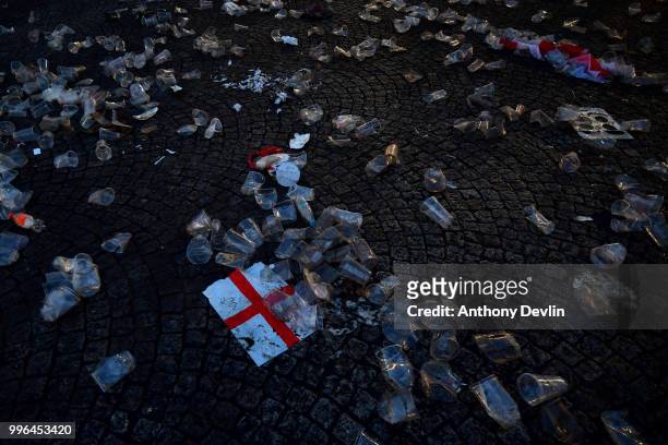 Empty glasses and flags are seen left behind after football fans watched England lose to Croatia at the Auto Trader World Cup semi-final screening in...