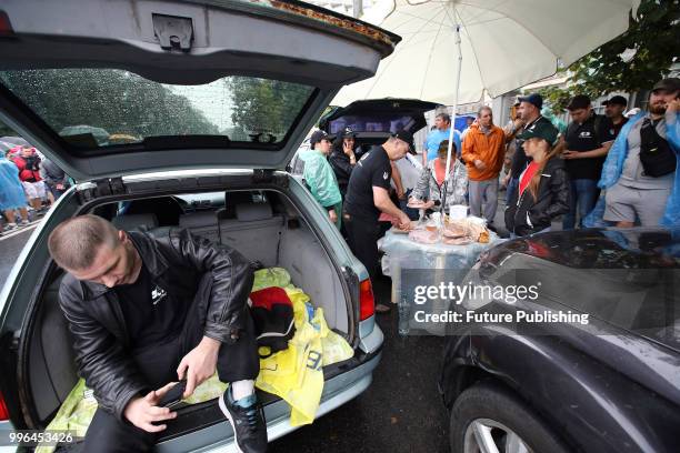 Demonstrators make sandwiches during a rally for the adoption of a draft bill on customs clearance and lower tax incidence on used cars brought from...