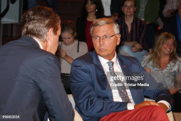 German presenter Markus Lanz and German politician Wolfgang Bosbach during the 'Markus Lanz' TV show on July 11, 2018 in Hamburg, Germany.