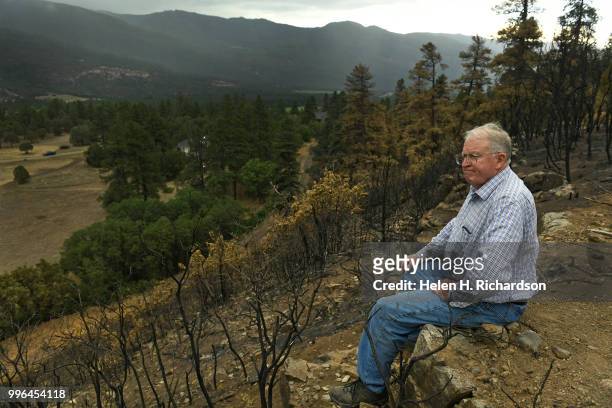 Cres Fleming sits at the top of the ridge above the train tracks in the exact area where he says the 416 fire started on July 10, 2018 near Hermosa,...