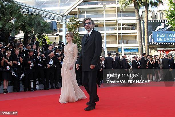 Director and president of the jury Tim Burton and French actress Isabelle Huppert arrive for the screening of "Biutiful" presented in competition at...