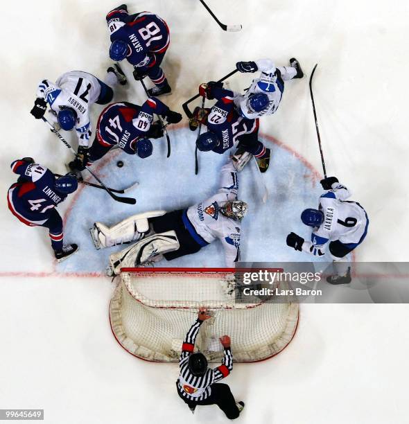 Goalie Pekka Rinne of Finland is challenged by Richard Lintner, Marek Svatos, Miroslav Satan and Ivan Ciernik of Slovakia during the IIHF World...