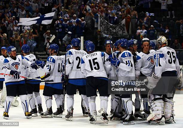 Goaltender Pekka Rinne of Finland celebrates with his team mates after winning the IIHF World Championship qualification round match between Finland...