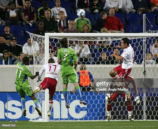 Brad Evans of the Seattle Sounders FC heads the ball over the net against the New York Red Bulls during the game at Red Bull Arena on May 15, 2010 in...