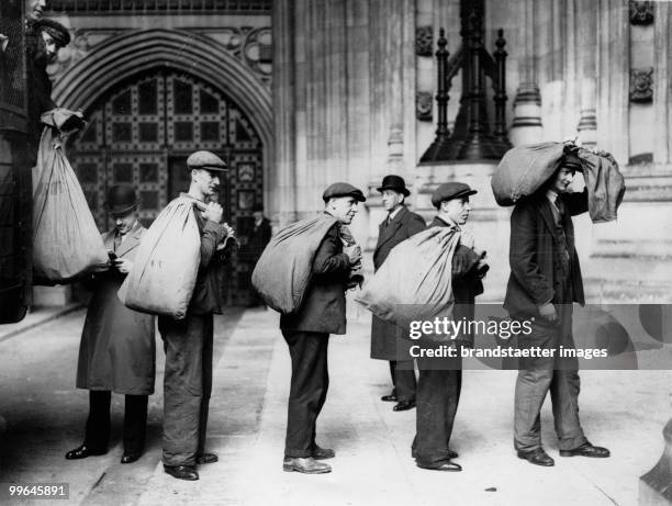 Millions of ballot cards are collected in sacks and carried to the Victoria Tower of the House of Commons for six months. London. Photograph....