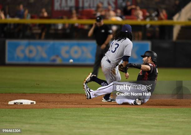 Alex Avila of the Arizona Diamondbacks slides safely into second base after hitting a single and advancing on an error during the first inning...