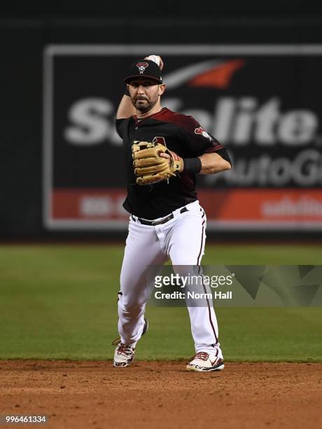 Daniel Descalso of the Arizona Diamondbacks makes a throw to first base against the San Diego Padres at Chase Field on July 7, 2018 in Phoenix,...