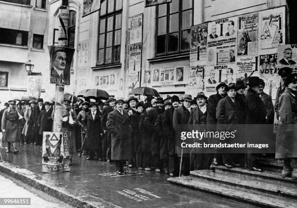 The picture shows Romanian People waiting in front of a polling station. Bukarest, Romania. Photograph. Around 1930.