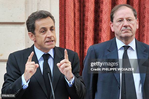 French President Nicolas Sarkozy delivers a speech beside French Trade and Tourism Minister Herve Novelli prior to a meeting on farming trade at the...