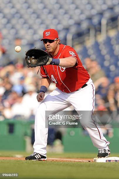 Adam Dunn of the Washington Nationals catches the ball during the game against the Colorado Rockies at Nationals Park on April 22, 2010 in...