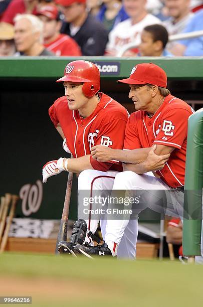 Manager Jim Riggleman and Josh Willingham of the Washington Nationals talk during the game against the Colorado Rockies at Nationals Park on April...