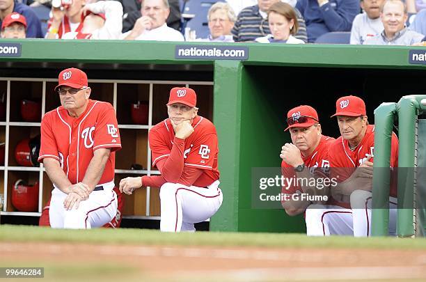 Manager Jim Riggleman, Pitching coach Steve McCatty, First base coach Dan Radison and Bench coach John McLaren of the Washington Nationals watch the...