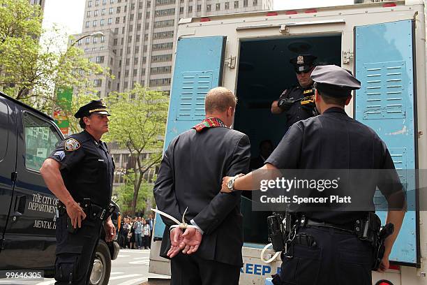 Man is arrested during an act of civil disobedience to protest against the lack of an immigration reform bill on May 17, 2010 in New York, New York....