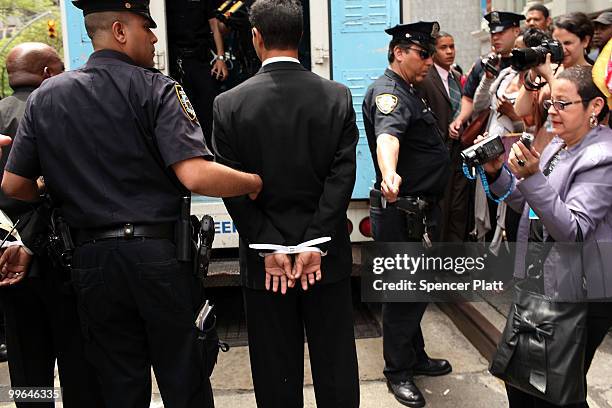 Man is arrested during an act of civil disobedience to protest against the lack of an immigration reform bill on May 17, 2010 in New York City....