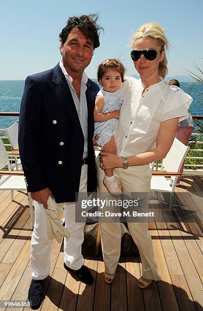 Giorgio Veroni and Tamara Beckwith pose with daughter Violet during the David Morris Amend Charity Luncheon at the Hotel du Cap as part of the 63rd...