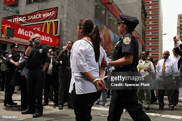 Woman is arrested during an act of civil disobedience to protest against the lack of an immigration reform bill on May 17, 2010 in New York City....