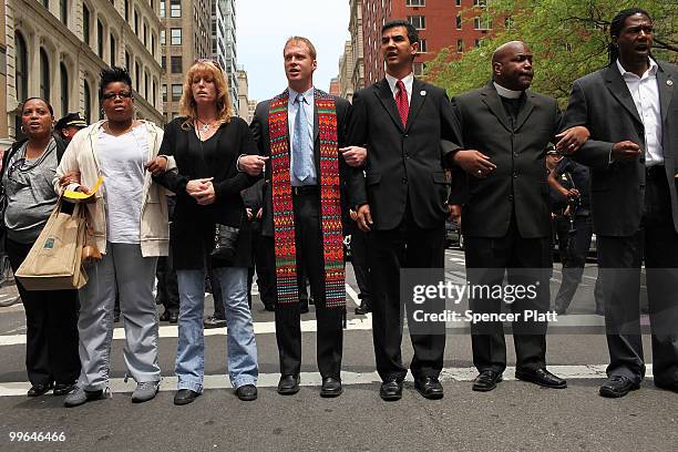 People block traffic during an act of civil disobedience to protest against the lack of an immigration reform bill on May 17, 2010 in New York City....