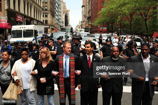 People block traffic during an act of civil disobedience to protest against the lack of an immigration reform bill on May 17, 2010 in New York City....