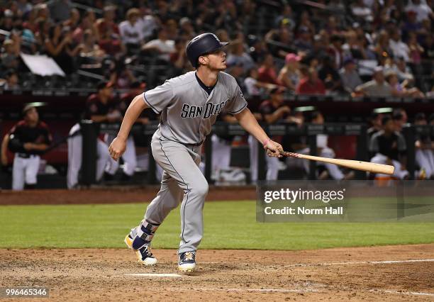 Wil Myers of the San Diego Padres hits his third home run of the game during the seventh inning against the Arizona Diamondbacks at Chase Field on...