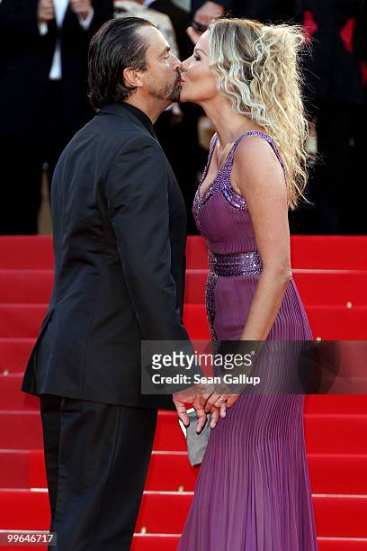 Former tennis player Henri Leconte kisses wife Florentine Leconte as they attend "Biutiful" Premiere at the Palais des Festivals during the 63rd...