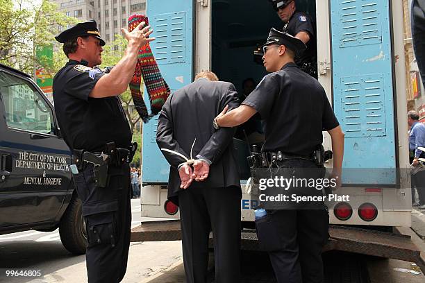 Man is arrested during an act of civil disobedience to protest against the lack of an immigration reform bill on May 17, 2010 in New York, New York....