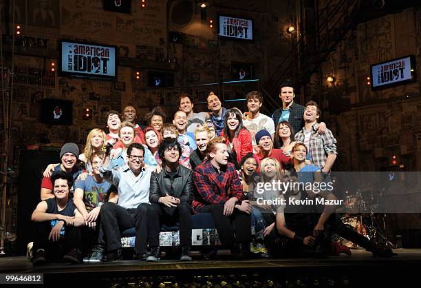 Director Michael Mayer, Billie Joe Armstrong, Mike Dirnt and Tre Cool of Green Day and the cast of "American Idiot" on stage during the "American...