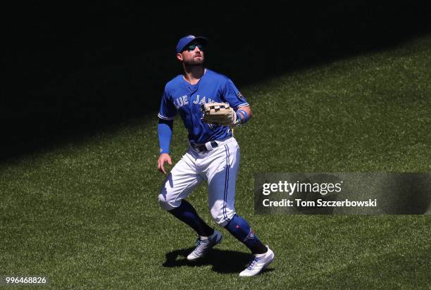 Kevin Pillar of the Toronto Blue Jays chases a fly ball before catching it in the fifth inning during MLB game action against the New York Yankees at...