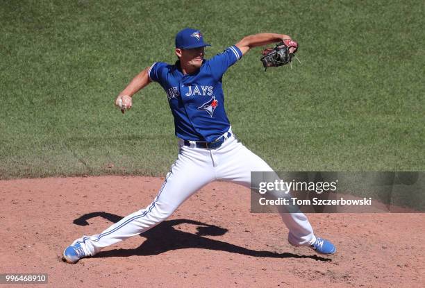 Tyler Clippard of the Toronto Blue Jays delivers a pitch in the tenth inning during MLB game action against the New York Yankees at Rogers Centre on...