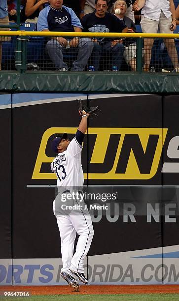 Outfielder Carl Crawford of the Tampa Bay Rays catches a fly ball against the Seattle Mariners during the game at Tropicana Field on May 15, 2010 in...