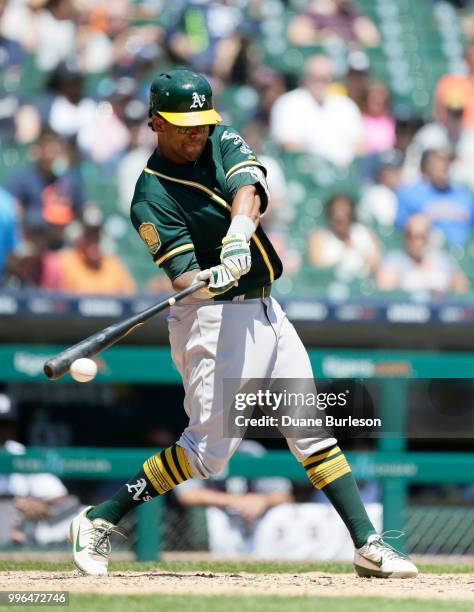 Khris Davis of the Oakland Athletics singles against the Detroit Tigers during the fifth inning at Comerica Park on June 28, 2018 in Detroit,...