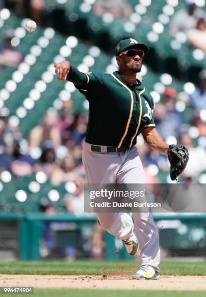 Shortstop Marcus Semien of the Oakland Athletics throws to first base against the Detroit Tigers at Comerica Park on June 28, 2018 in Detroit,...