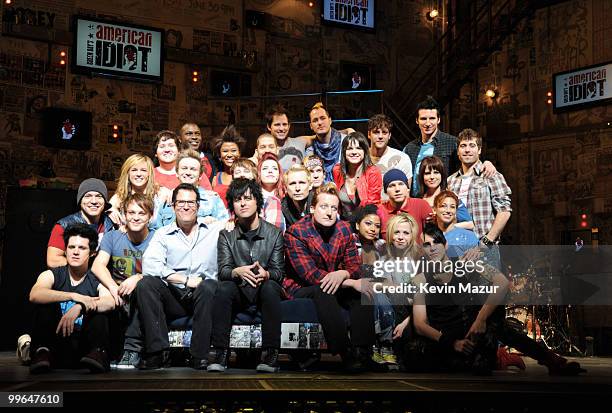 Director Michael Mayer, Billie Joe Armstrong, Mike Dirnt and Tre Cool of Green Day and the cast of "American Idiot" on stage during the "American...