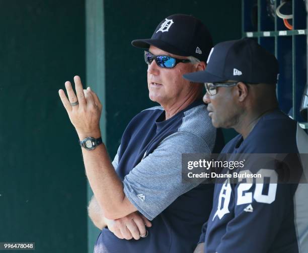 Pitching coach Rick Anderson of the Detroit Tigers talks with hitting coach Lloyd McClendon of the Detroit Tigers during a game against the Oakland...