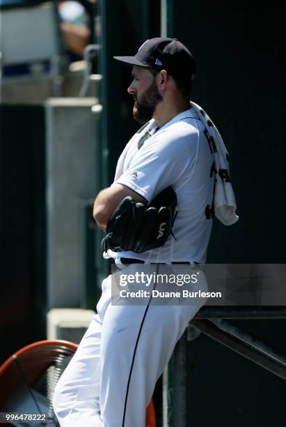 Starting pitcher Michael Fulmer of the Detroit Tigers watches from the dugout during a game against the Oakland Athletics at Comerica Park on June...