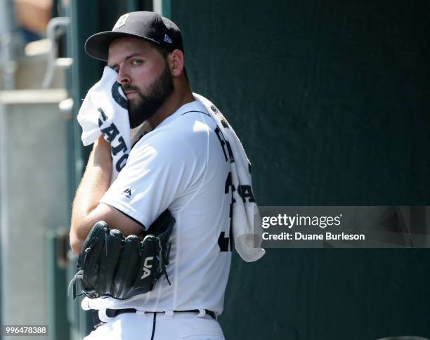 Starting pitcher Michael Fulmer of the Detroit Tigers watches from the dugout during a game against the Oakland Athletics at Comerica Park on June...