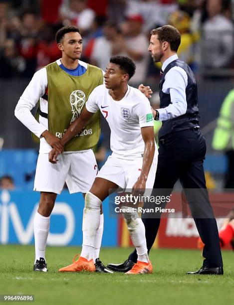 Trent Alexander-Arnold of England and Gareth Southgate, Manager of England embrace Jesse Lingard of England after the 2018 FIFA World Cup Russia Semi...