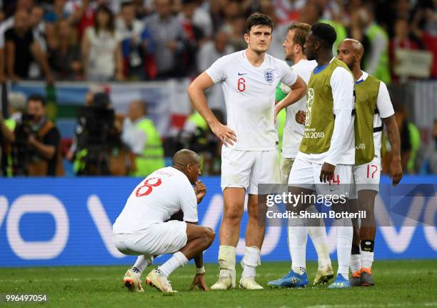 Ashley Young, Harry Maguire, Harry Kane, Danny Welbeck, Fabian Delph of England look dejected after the 2018 FIFA World Cup Russia Semi Final match...