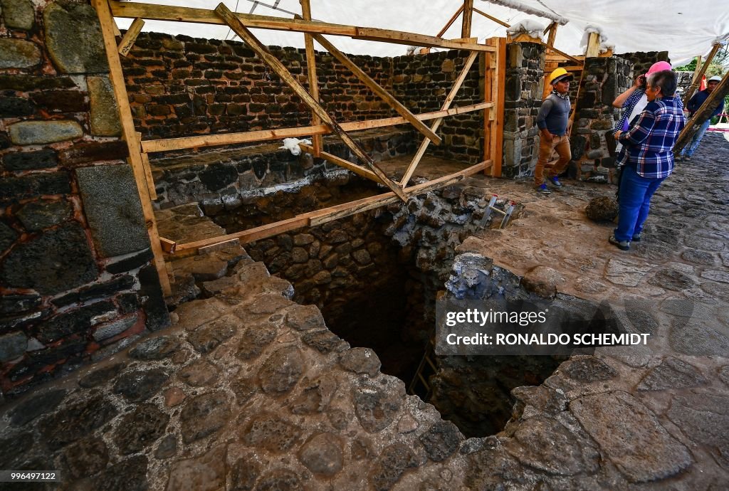 People work on a substructure inside the Teopanzolco pyramid in... News ...