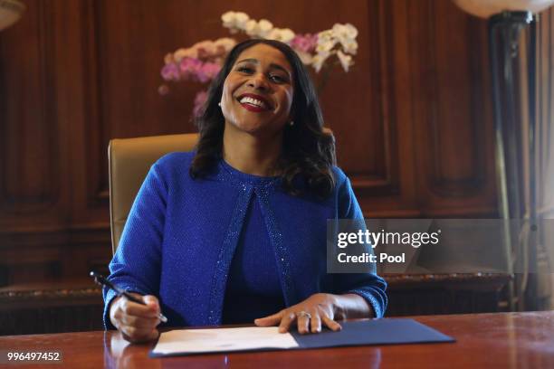 Mayor London Breed signs the oath of office after her inauguration at City Hall July 11, 2018 in San Francisco, California.
