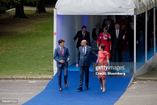 Justin Trudeau, Canada's prime minister, left, speaks with Charles Michel, Belgian's prime minister, center, while arriving for a working dinner...