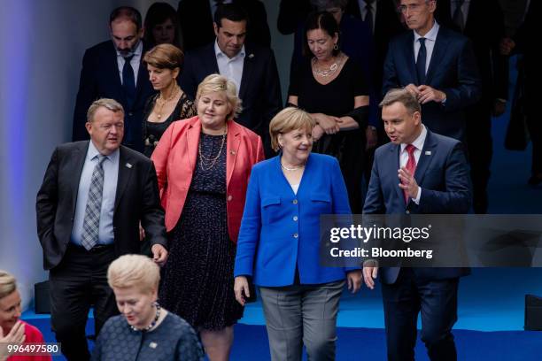 Andrzej Duda, Poland's president, from right, speaks with Angela Merkel, Germany's chancellor, while arriving for a working dinner during the North...