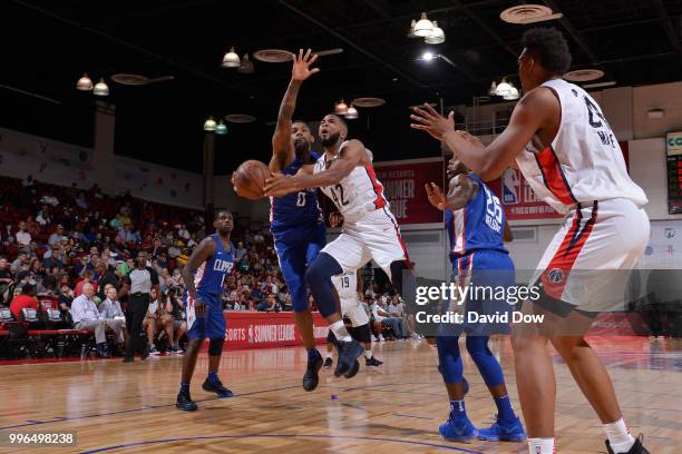 Aaron Harrison of the Washington Wizards goes to the basket against the LA Clippers during the 2018 Las Vegas Summer League on July 11, 2018 at the...