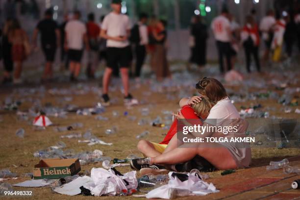 England supporters react at an outdoor screening in Hyde Park in central London as England lose the 2018 World Cup semi-final against Croatia in...