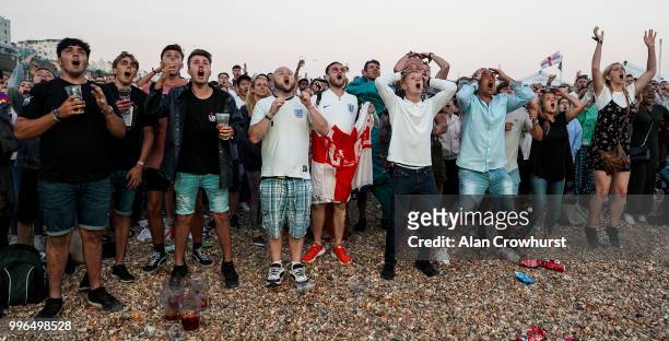 England fans react to a near miss during the 2018 FIFA World Cup semi final match between Croatia and England at the Luna Beach Cinema on Brighton...