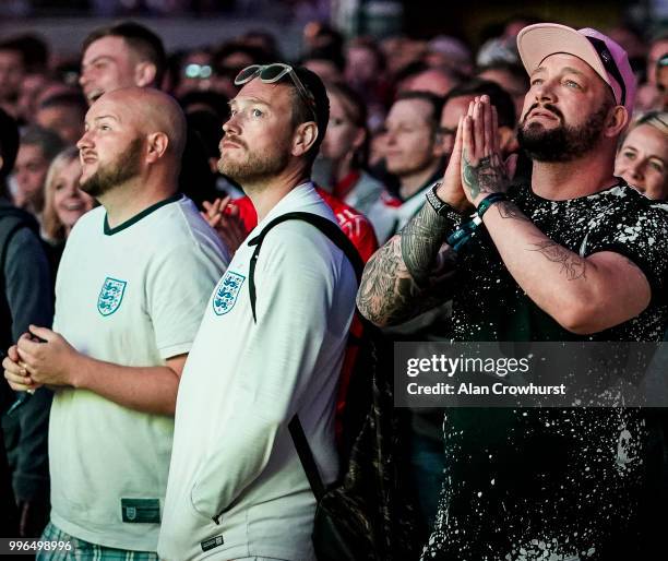 England fans pray for the best during the 2018 FIFA World Cup semi final match between Croatia and England at the Luna Beach Cinema on Brighton Beach...