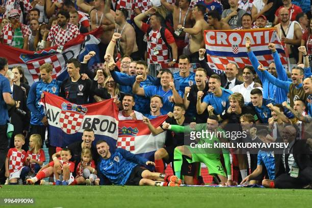 Croatia's players celebrate at the end of the Russia 2018 World Cup semi-final football match between Croatia and England at the Luzhniki Stadium in...