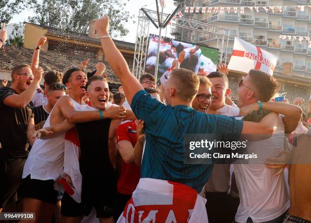 England fans celebrate England's opening goal while watching the World Cup semi-final match against Croatia on a giant screen in an open air viewing...