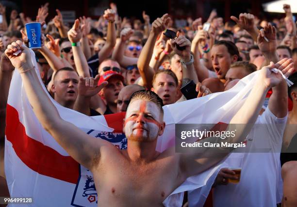 England fans gather to watch the World Cup semi-final match against Croatia in an outside viewing area on July 11, 2018 in Magaluf, Mallorca, Spain....