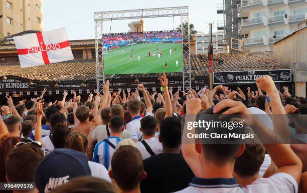 England fans react while watching the World Cup semi-final match against Croatia on a giant screen in an open air viewing area on July 11, 2018 in...